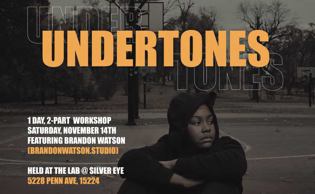 Promotional poster featuring a monochromatic dark brown photograph of a young Black person in a dark hoodie sitting in the center of an empty outdoor basketball court with their knees drawn up and their arms crossed over the knees. The word “Undertones” appears over their head in all caps orange text. On the left side of the person are two blocks of text in alternating sections of white and orange that provide a description as well as time and location info. The first section reads, "1 day, 2-part workshop / Saturday, November 14th / Featuring Brandon Watson (brandon watson.studio)." The second section reads, "Held at The Lab @ Silver Eye / 5228 Penn Ave, 15224."