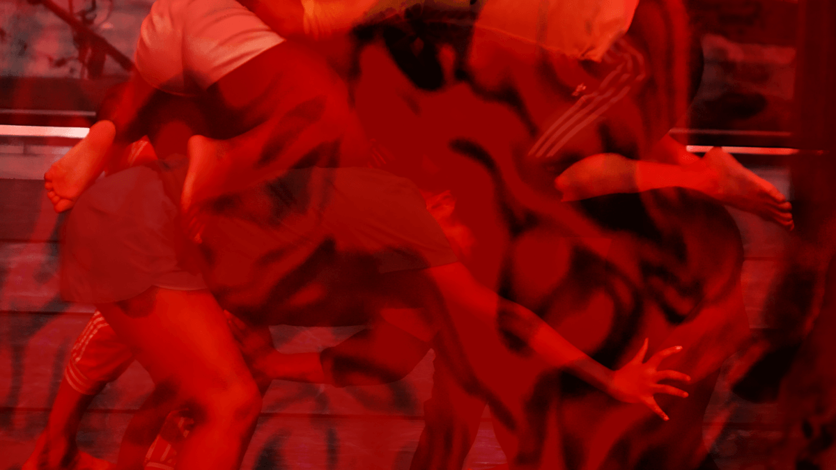 A group of dancers sharing weight and limbs intertwined. The photo is edited with red drawing overlayed to obscure yet enhance the figures.