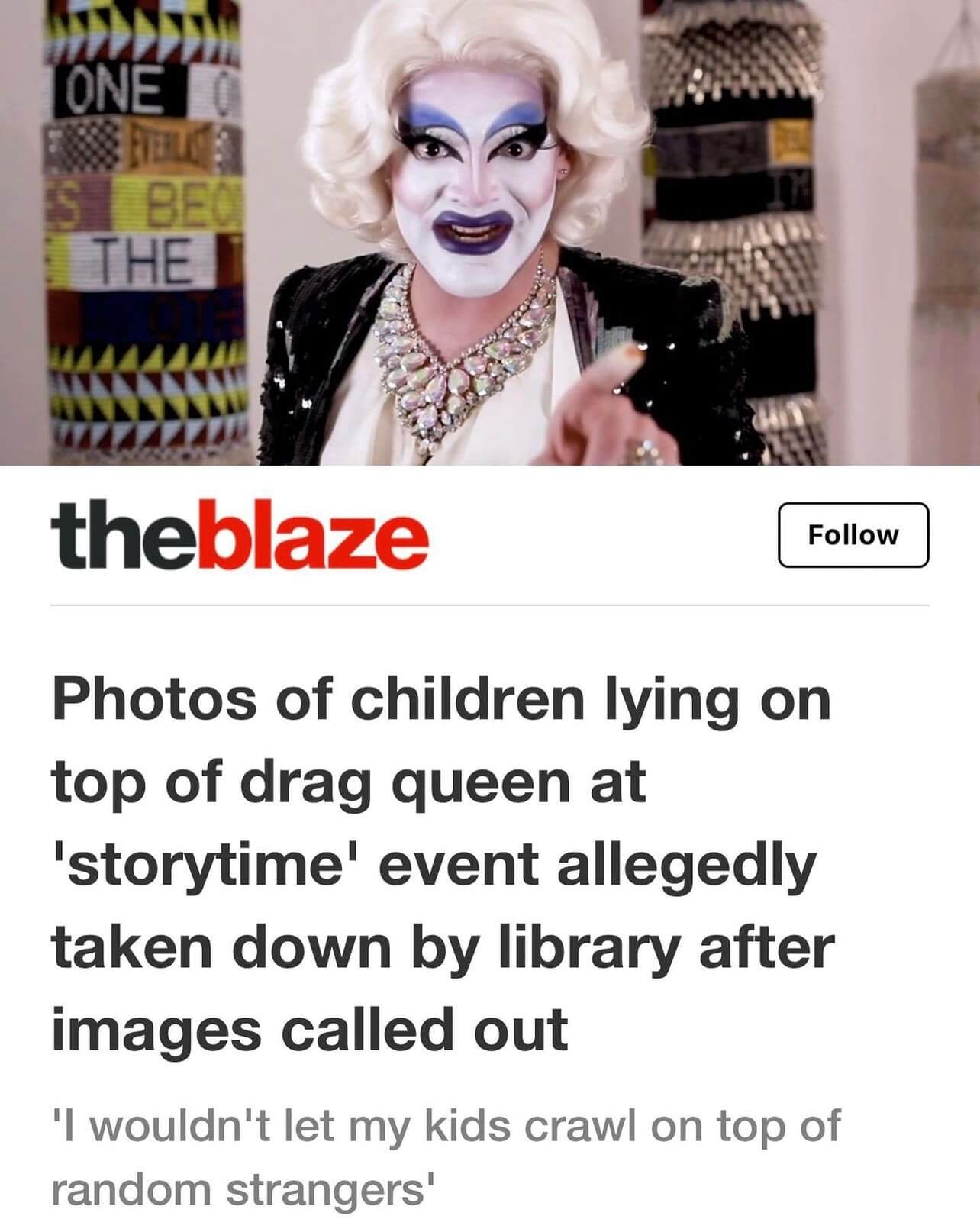 Screen shot of an online article from The Blaze. The headline reads, "Photos of children lying on top of drag queen at 'storytime' event allegedly taken down by library after images called out". The subheading reads, "'I wouldn't let my kids crawl on top of random strangers.'" The accompanying photo shows Carla Rossi in a medium-length white wig and dark violet lipstick, wearing an embroidered black jacket with padded shoulders and pointing at the camera.