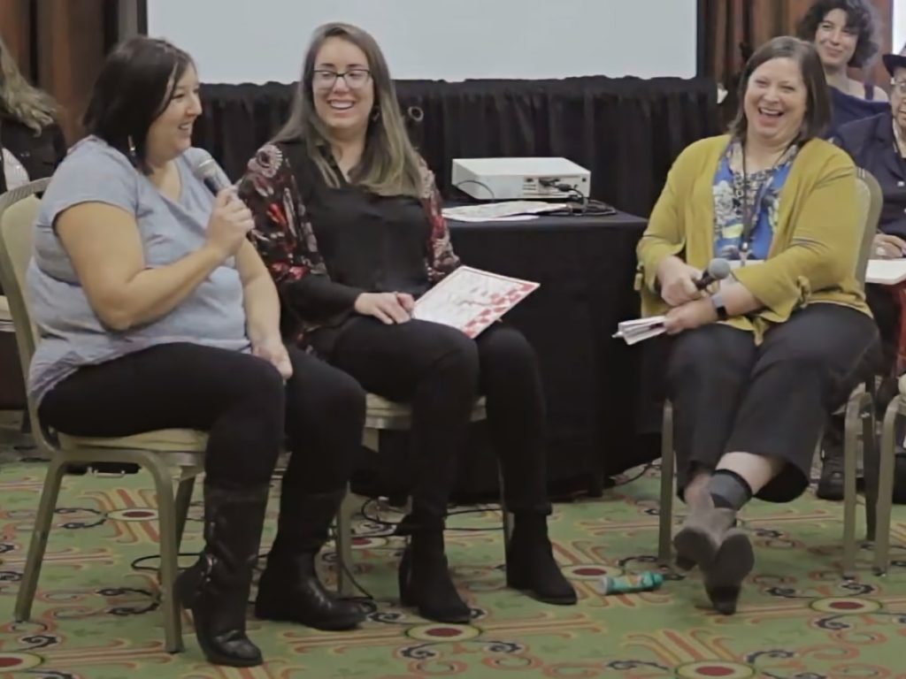Photo of LANE cohort members All My Relations Arts of Minneapolis, Minnesota, and Movimiento de Arte y Cultura Latino Americana (MACLA) of San Jose, California interviewing each other at the 2019 National Performance Network Conference.