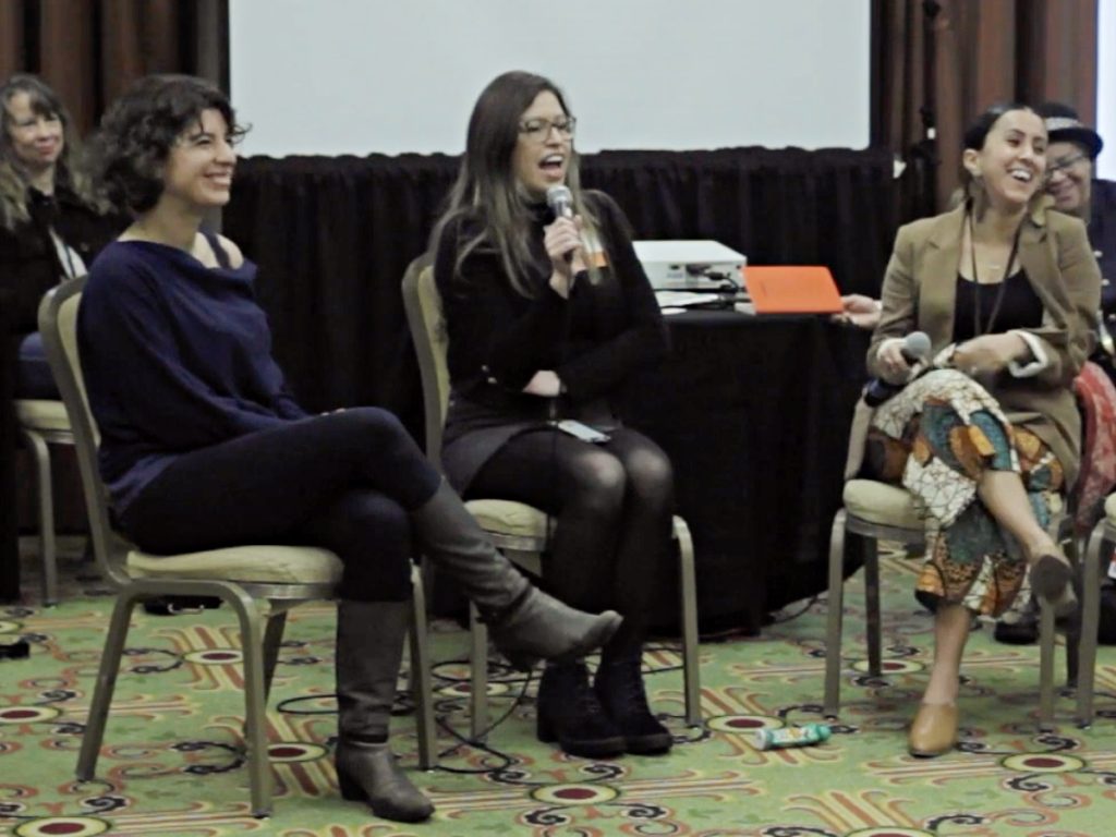 Photo of LANE cohort members Junebug Productions of New Orleans, Louisiana, and La Peña Cultural Center of Berkley, California interviewing each other at the 2019 National Performance Network Conference.