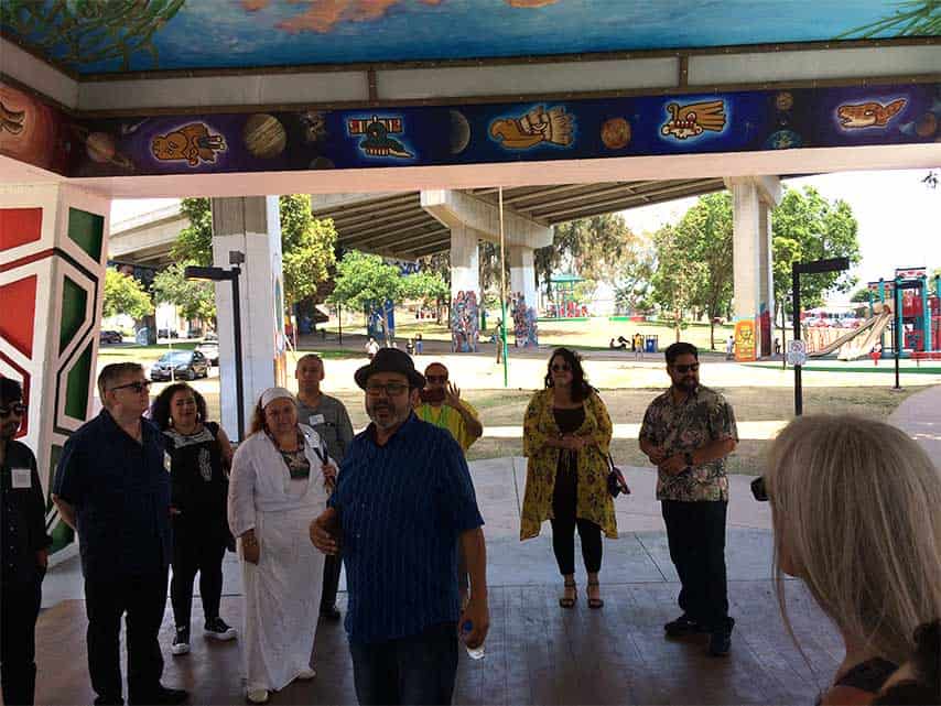 Mario Chacon, a long time community member and artist, leads our tour of La Bodega Gallery and Chicano Park, before walking over to Bread & Salt Gallery as a group.